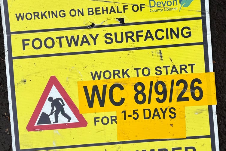 A Tavistock couple were briefly marooned outside their house by wet tarmac which had no 'keep clear' sign.