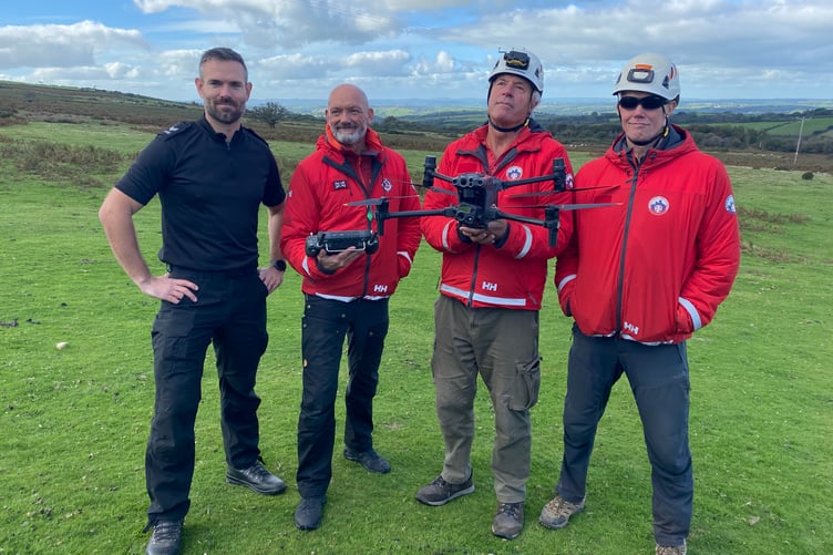 Volunteers learn how to use a drone to find missing and those in trouble on Dartmoor, helped by Sgt Chris Linzey, of Devon & Cornwall Police drone unit.