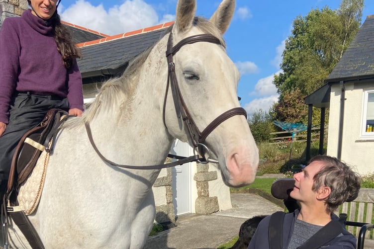 Robyn Jordan on horseback with her friend Trelawney Whitehead, outside Trelawney's home in Drewsteignton.
