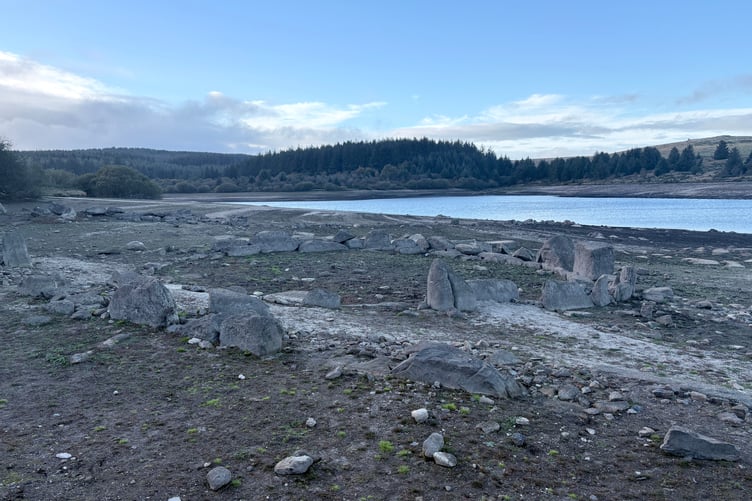 The reservoir's water level is so low that the remains of a Bronze Age hut circle are now visible.