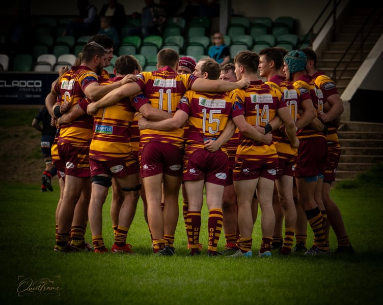 Okehampton RFC huddle on opening day. Picture: @Quiteframe.studio