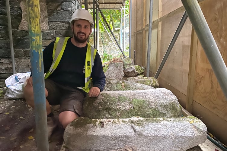 Stonemason Peter Cross is pictured with some stone structural remains on the ground floor of Betsy Grimbal's tower in Tavistock.