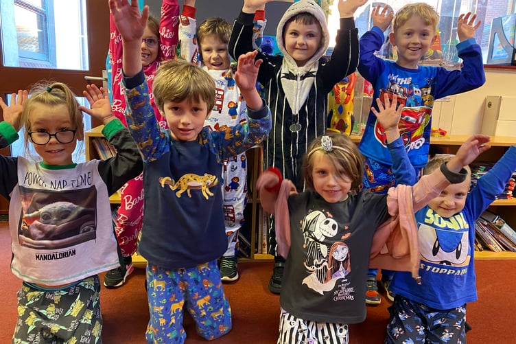 Horrabridge Primary School and Nursery thank a choir by dressing in pyjamas for the day.