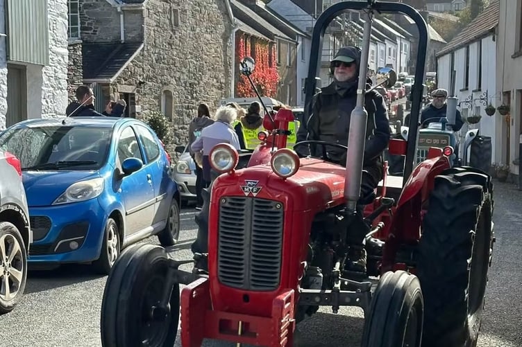Fran Mudge's tribute tractor run attracts crowds through Buckland Monachorum. Picture by Ann Glanville.