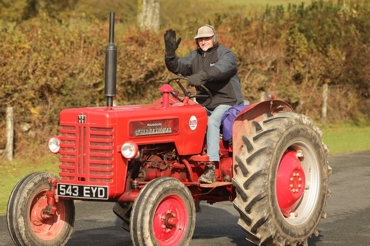 One of a happy parade of tractor drivers in Fran Mudge's charity rally. Picture by Chris Cottrell.