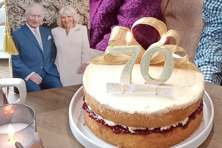 Ron and Joan Haycock's celebrate their seventieth wedding anniversary in Bere Ferrers with a card from the King and Queen and a cake.