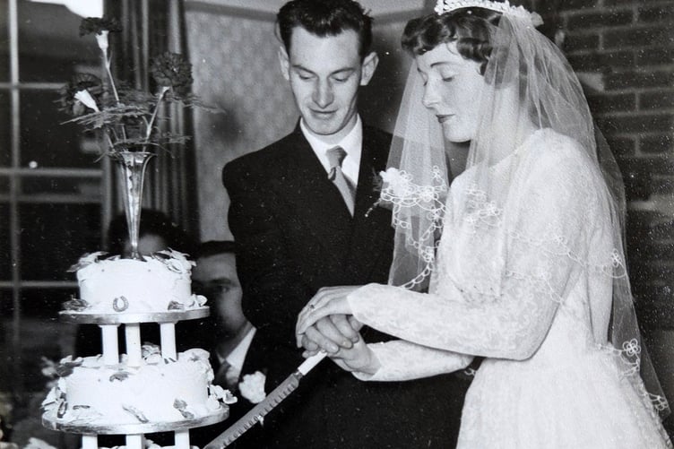 Joan and Ron Haycock have celebrated their seventieth wedding anniversary in Bere Ferrers. They are pictured cutting their wedding cake.